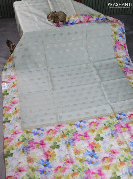 Chiniya silk saree pastel shade with allover zari woven buttas and floral digital printed border