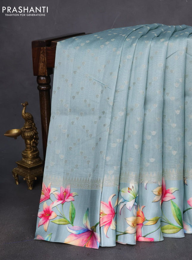 Chiniya silk saree pastel green with allover silver zari weaves and floral digital printed border