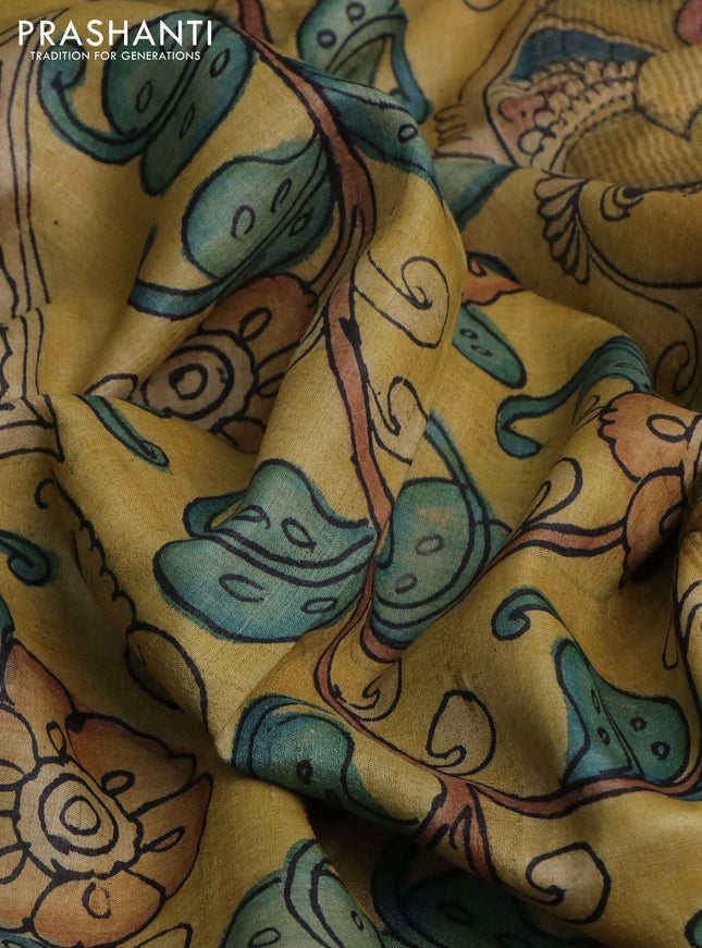 Pure tussar silk saree peach pink and mustard shade with allover pen kalamkari prints and zari woven border