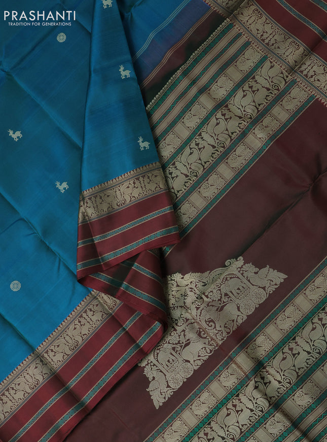 Pure kanchipuram silk saree dual shade of bluish green and maroon with thread woven buttas and thread woven border