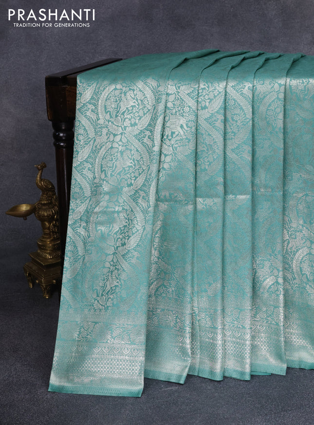Banarasi silk saree pastel green with allover silver zari woven brocade weaves and silver zari woven border