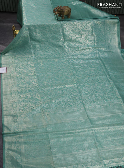 Banarasi silk saree pastel green with allover silver zari woven brocade weaves and silver zari woven border