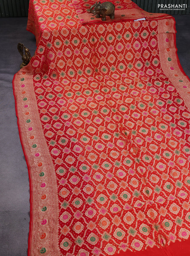 Banarasi georgette saree orange and red with bandhani prints & mina weaves and woven border