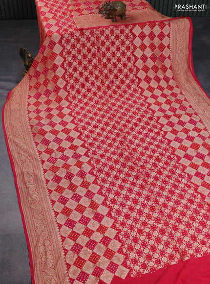 Banarasi georgette saree reddish pink with bandhani prints & zari weaves and woven border