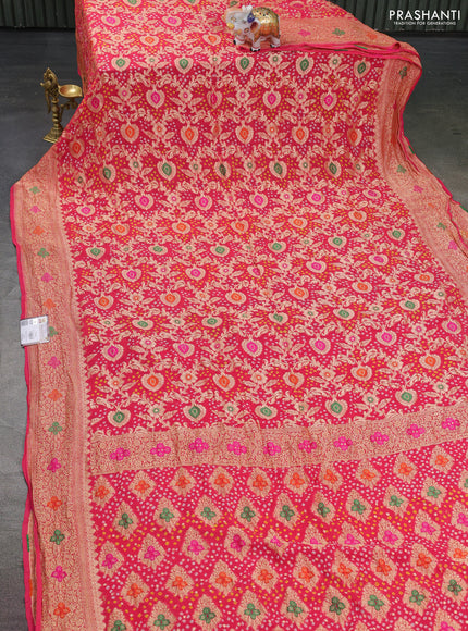 Banarasi georgette saree peach pink with bandhani prints & mina weaves and woven border