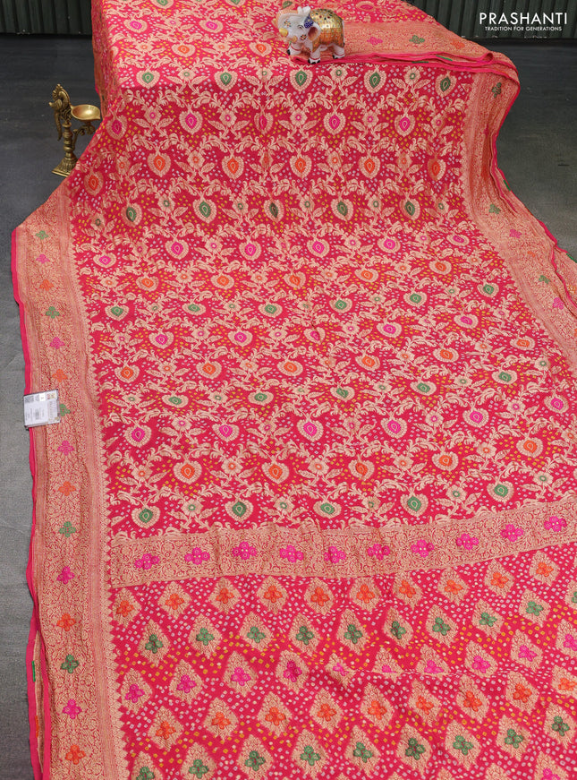 Banarasi georgette saree peach pink with bandhani prints & mina weaves and woven border