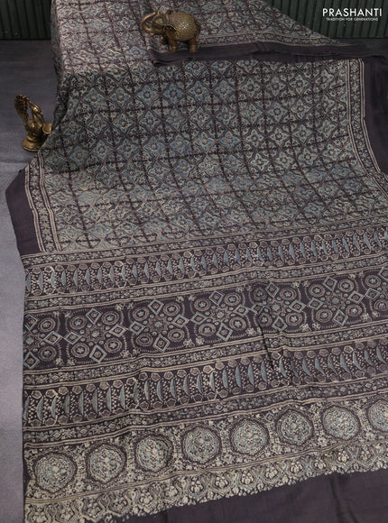 Printed silk saree grey shade with allover ajrakh prints and simple border