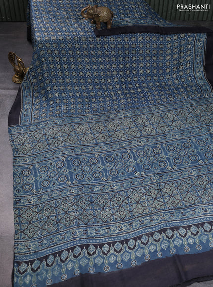 Printed silk saree blue and black with allover ajrakh prints and simple border