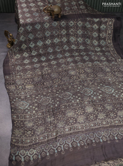 Printed silk saree grey shade with allover ajrakh prints and simple border