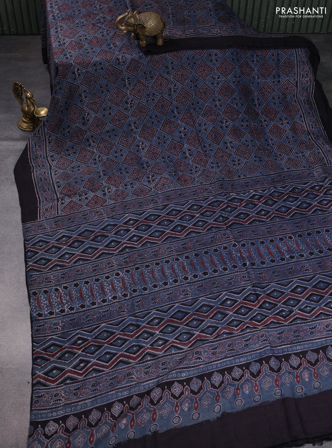 Printed silk saree bluish grey and black with allover ajrakh prints and simple border