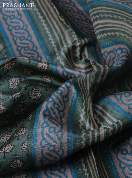 Pure tussar silk saree green shade with allover digital prints and long printed border