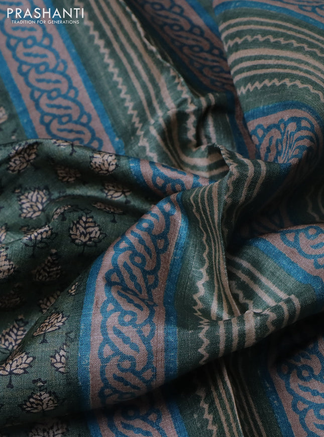 Pure tussar silk saree green shade with allover digital prints and long printed border