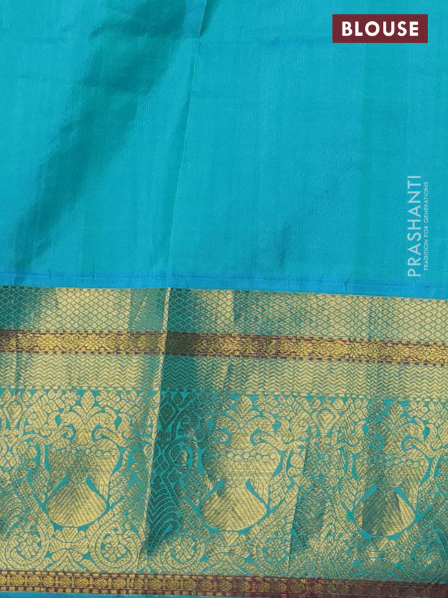 Pure kanchipuram silk saree blue and dual shade of teal blue with allover butta prints and floral embroidery cut work zari border