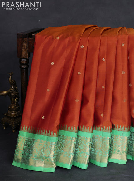 Pure gadwal silk saree honey shade and teal green shade with zari woven buttas and temple design zari woven border