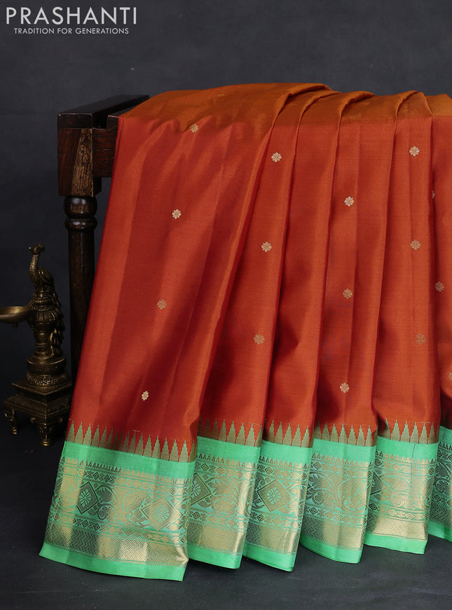 Pure gadwal silk saree honey shade and teal green shade with zari woven buttas and temple design zari woven border