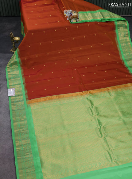 Pure gadwal silk saree honey shade and teal green shade with zari woven buttas and temple design zari woven border