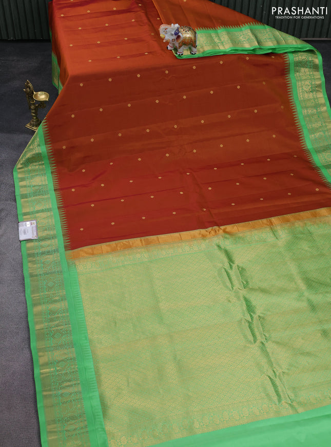 Pure gadwal silk saree honey shade and teal green shade with zari woven buttas and temple design zari woven border