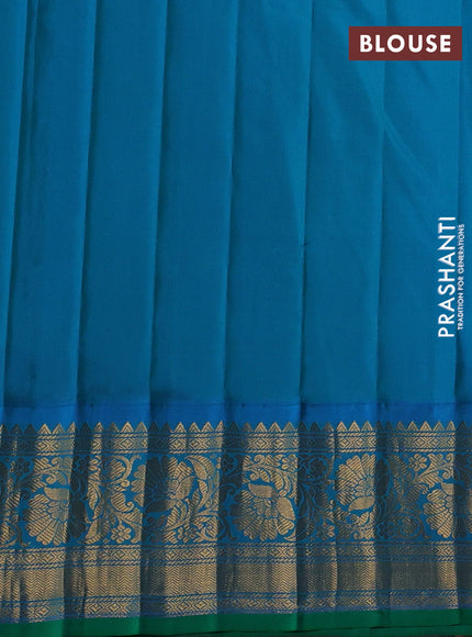 Pure gadwal silk saree dual shade of pinkish orange and dual shade of teal blue with allover zari weaves & buttas and floral zari woven border