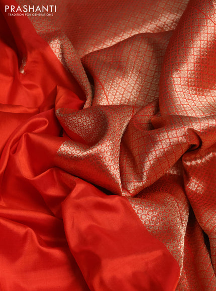 Banarasi katan silk saree reddish orange and greyish green with zari woven floral buttas and zari woven butta border