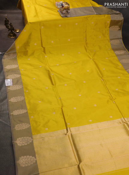 Banarasi katan silk saree yellow and grey shade with zari woven floral buttas and zari woven butta border