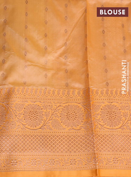 Banarasi katan silk saree pastel green and pale orange with copper zari woven buttas and zari woven border