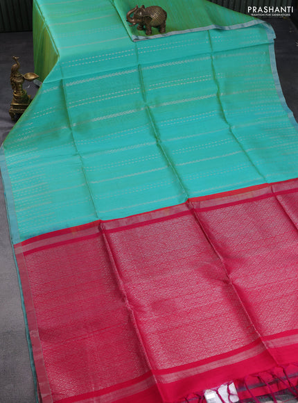 Pure raw silk saree dual shade of teal and reddish pink with allover silver zari weaves and small zari woven border