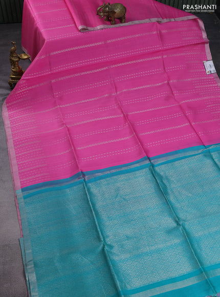 Pure raw silk saree peach pink and teal shade with allover silver zari weaves and small zari woven border