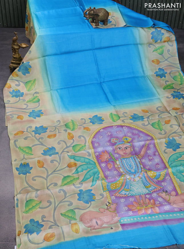Pure tussar silk saree cs blue and pastel brown with plain body and pichwai hand painted pallu & border