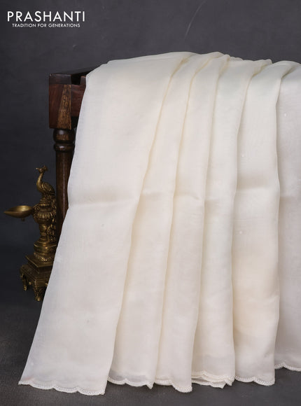 Pure organza silk saree cream with sequin buttas and beaded work border