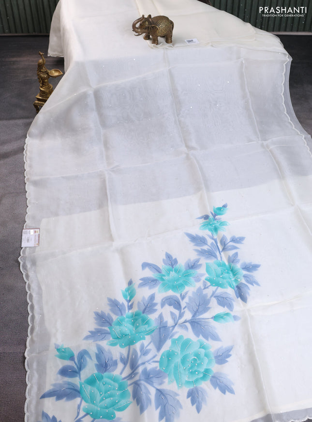 Pure organza silk saree cream with sequin buttas and beaded work border