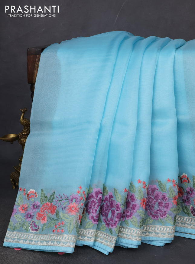 Pure organza silk saree light blue with plain body and floral embroidery border