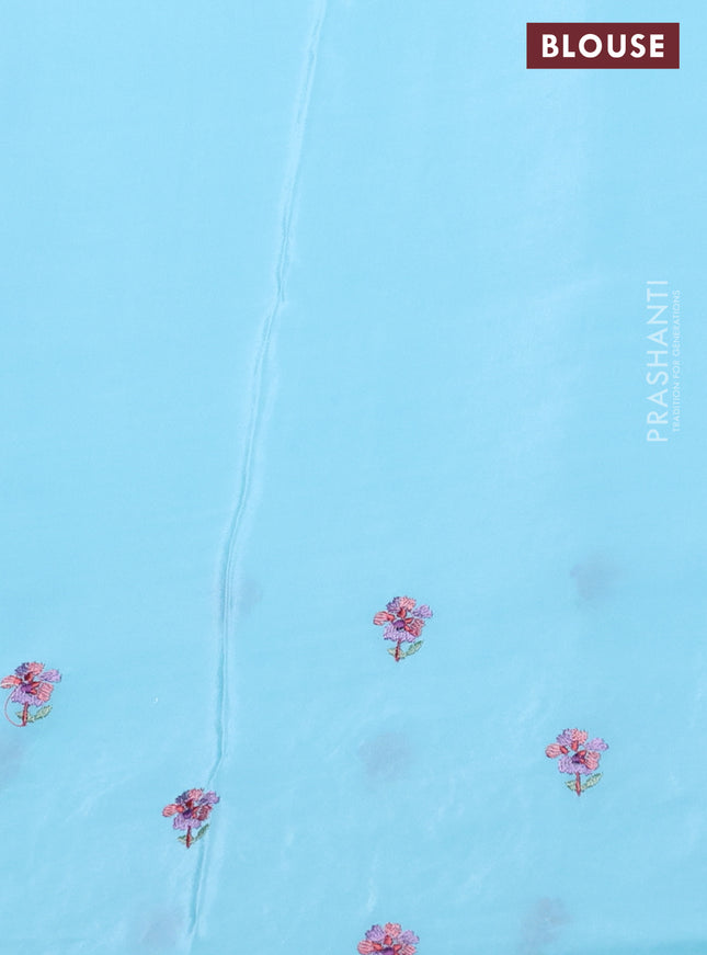 Pure organza silk saree light blue with plain body and floral embroidery border