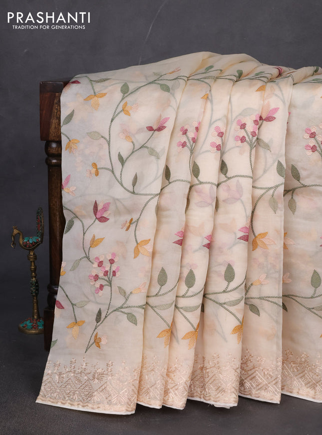 Pure organza silk saree cream with allover embroidery and embroidery border