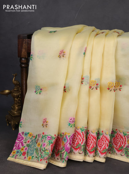 Pure organza silk saree pale yellow with embroidery buttas and petite embroidery border