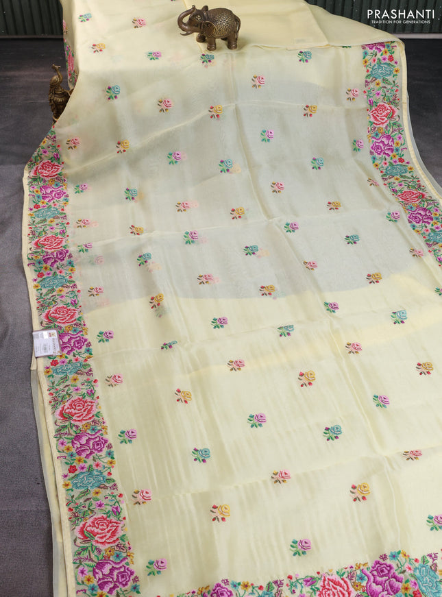Pure organza silk saree pale yellow with embroidery buttas and petite embroidery border