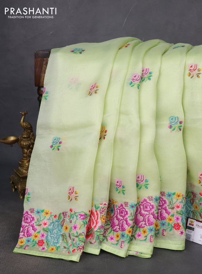 Pure organza silk saree pista green with embroidery buttas and petite embroidery border