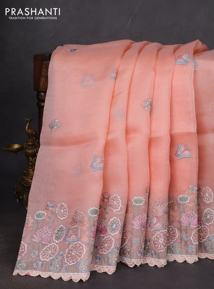 Pure organza silk saree peach shade with butterfly embroidery buttas and embroidery border