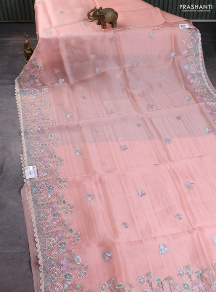 Pure organza silk saree peach shade with butterfly embroidery buttas and embroidery border