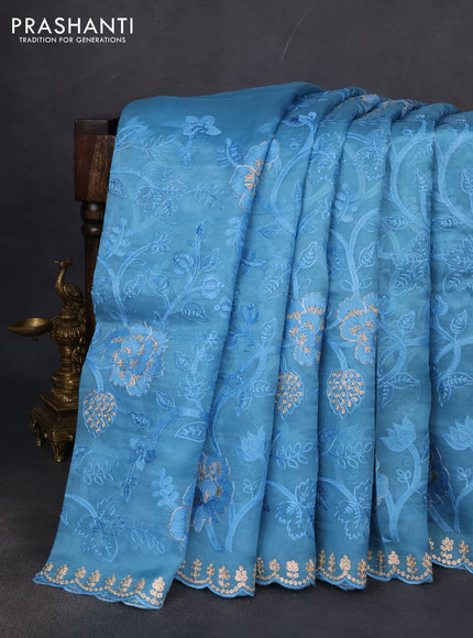 Pure organza silk saree blue shade with allover embroidery and embroidery border