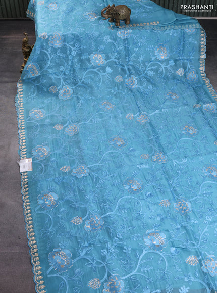 Pure organza silk saree blue shade with allover embroidery and embroidery border
