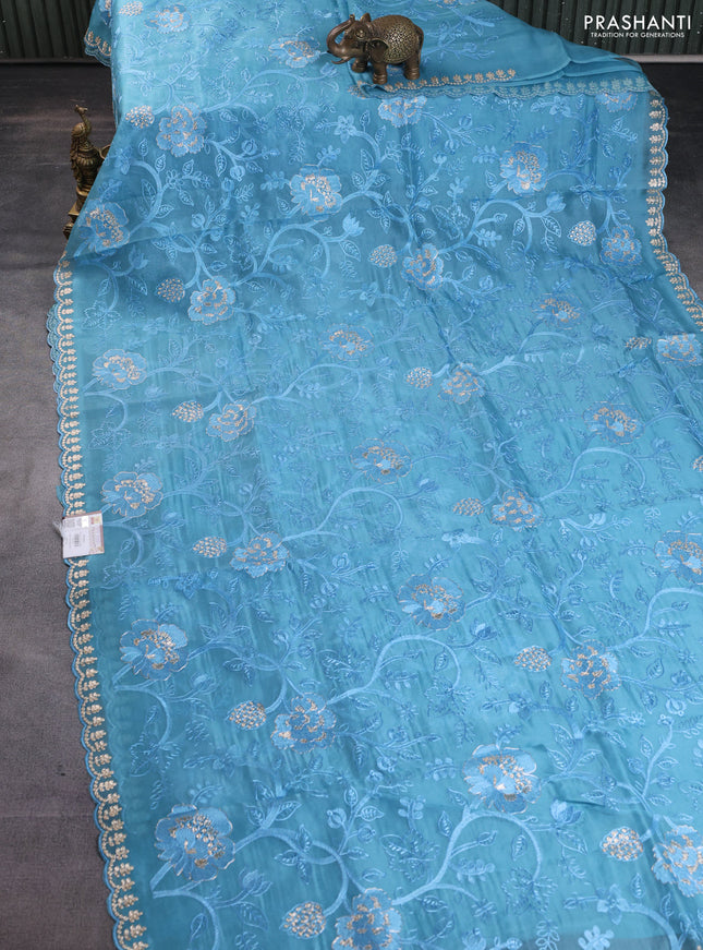 Pure organza silk saree blue shade with allover embroidery and embroidery border