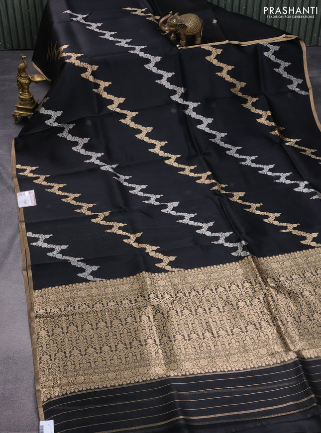 Banarasi organza silk saree black with silver & gold zari weaves and zari woven piping border