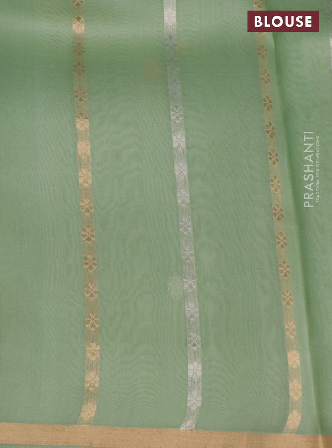 Banarasi organza silk saree pastel green with silver & gold zari weaves and zari woven piping border