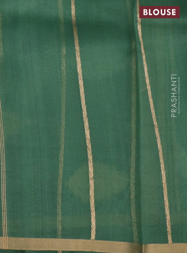 Banarasi organza silk saree pastel green with silver & gold zari weaves and zari woven piping border