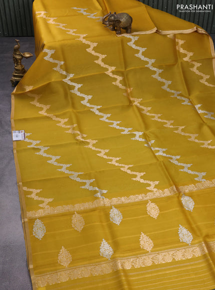 Banarasi organza silk saree mustard yellow with silver & gold zari weaves and zari woven piping border