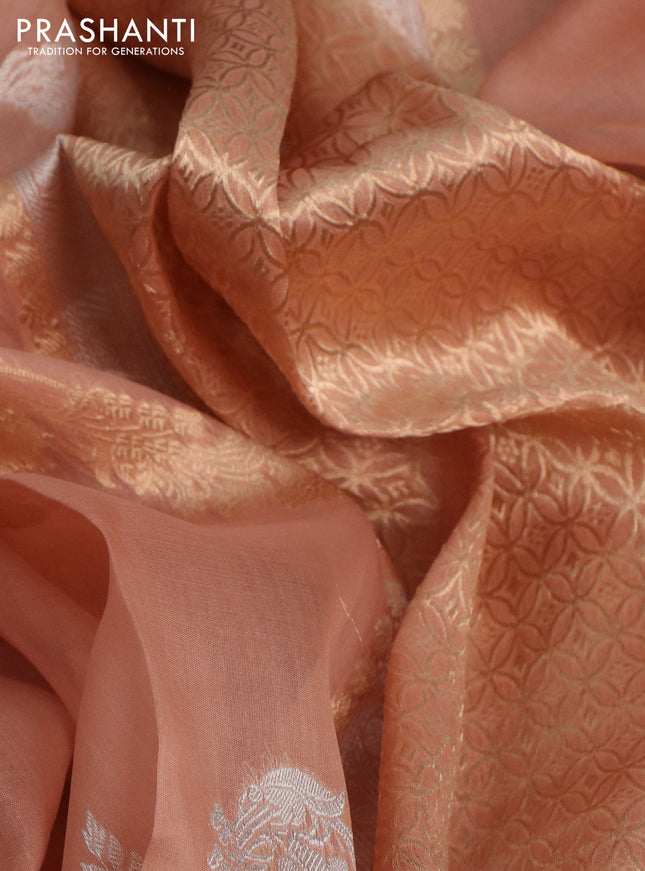 Banarasi organza silk saree pastel peach with allover silver & gold zari weaves and zari woven piping border