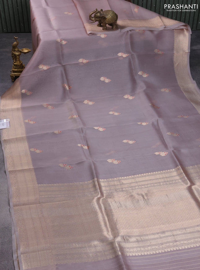 Banarasi organza silk saree pastel grey with zari woven buttas and zari woven border