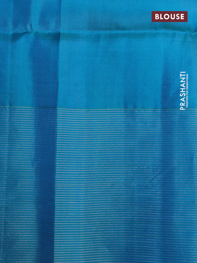 Pure soft silk saree dual shade of pinkish orange and teal blue with allover silver zari woven brocade weaves and zari woven border