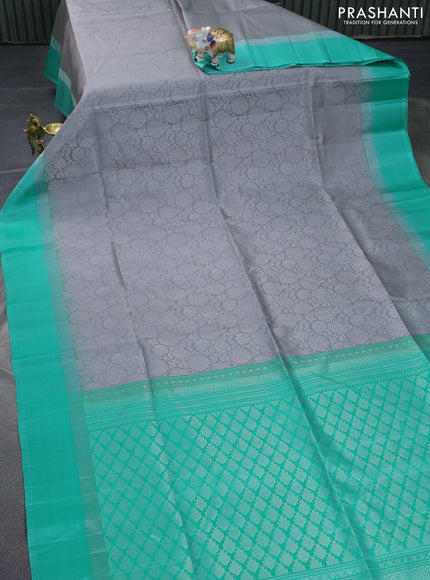 Pure soft silk saree grey and teal green with allover silver zari woven brocade weaves and zari woven simple border