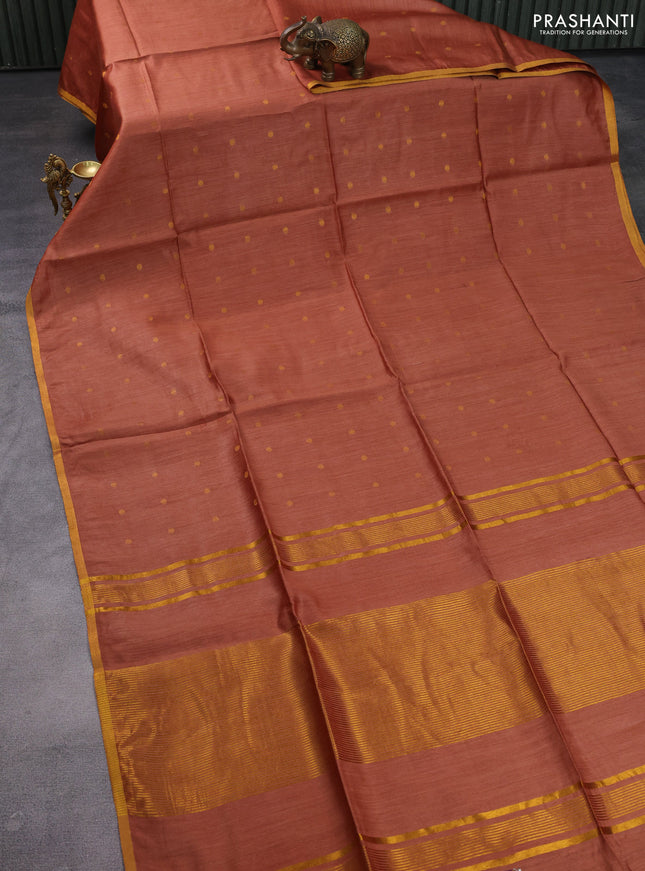 Munga tussar silk saree rust shade with allover zari woven buttas and zari woven border
